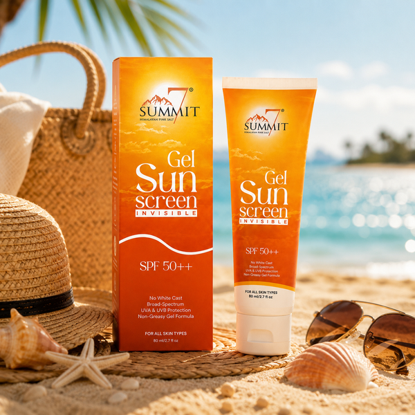 Sunscreen tube and matching box on a sandy beach with a straw hat, sunglasses, starfish, and ocean in the background. The products are branded Summit and labeled Gel Sunscreen Invisible SPF 50++.